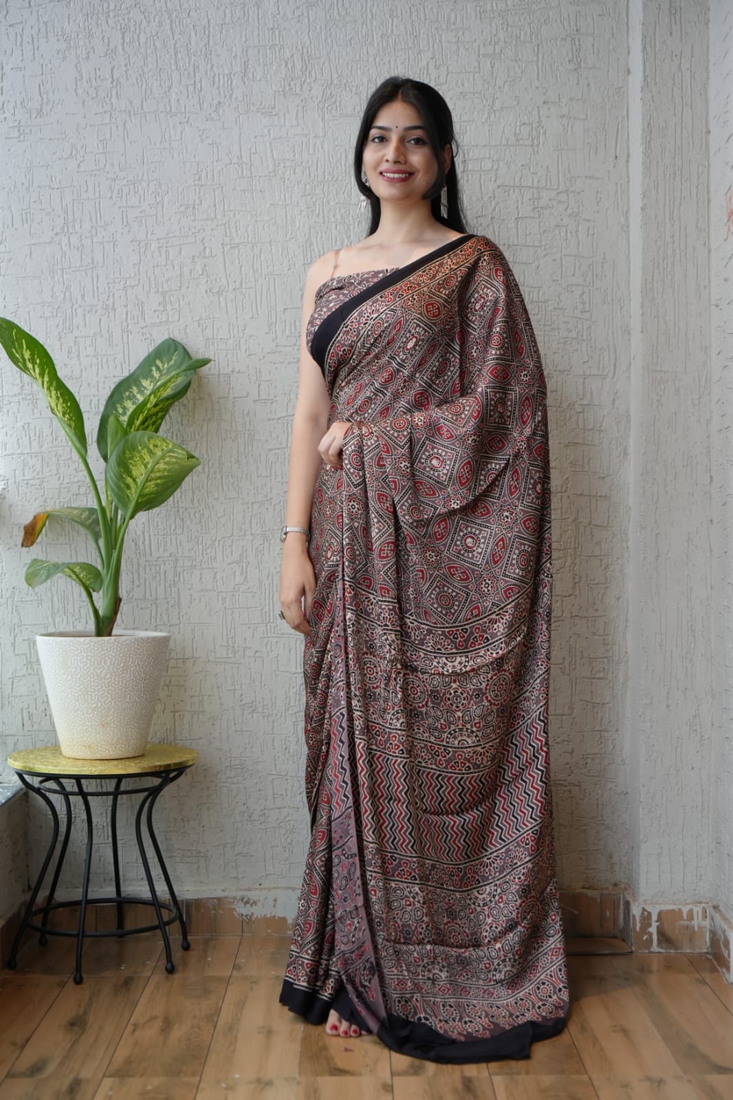 Handblock printed Ajrakh saree in earthy rust and black tones