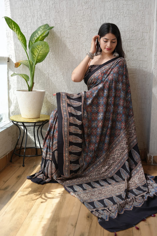 Handblock printed Ajrakh saree in bold black and red floral