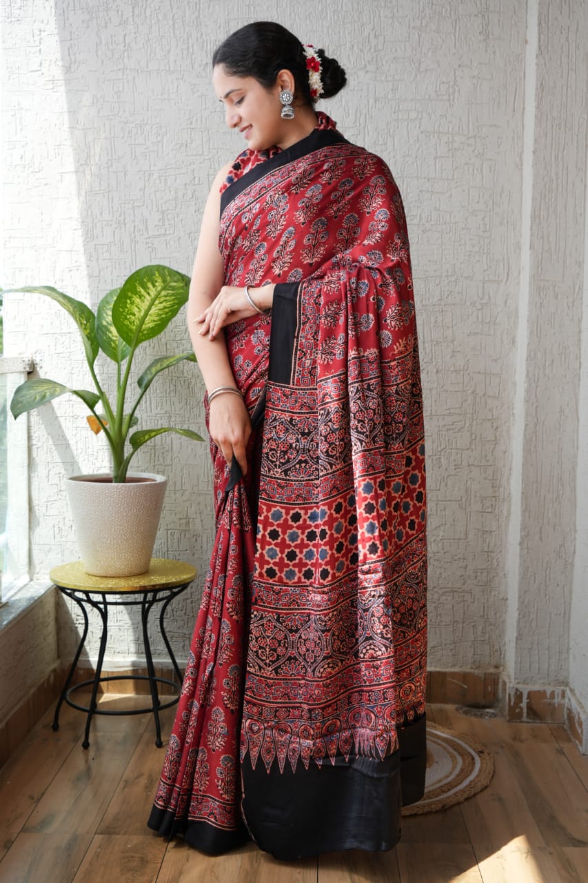 Handblock printed Ajrakh saree in maroon and black floral motifs