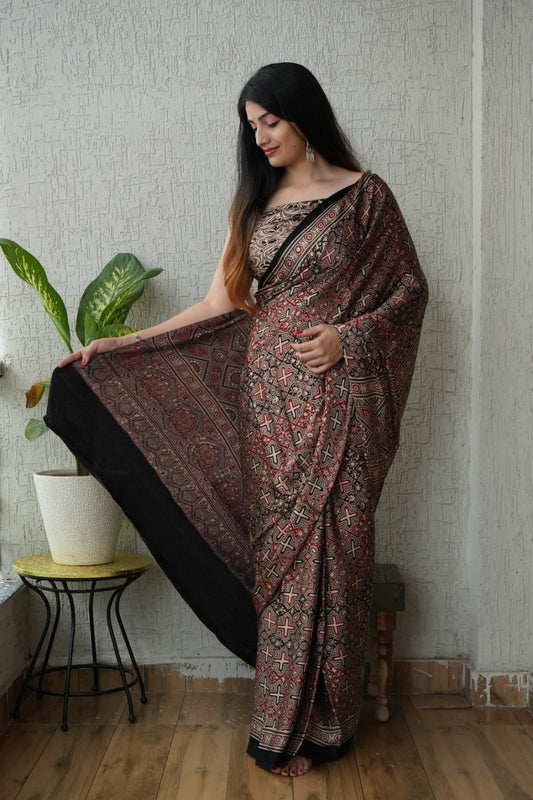 Handblock printed Ajrakh saree in earthy rust and black tones